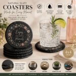 Personalized natural slate coaster featuring the quote "Enjoy The Little Moments" with floral wreath design, rustic stone finish, and custom gift coaster for home décor and drinkware protection.
