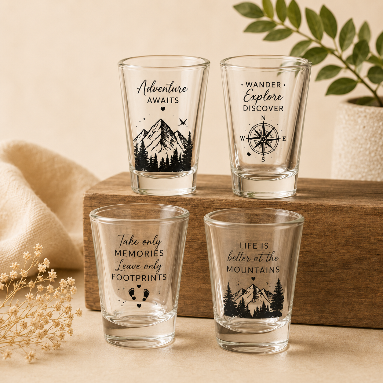 Custom Shot Glass Set of 4 | Personalized Adventure-Themed Shot Glasses Custom shot glass set of 4 featuring personalized adventure-themed designs with mountains, compass graphics, inspirational quotes, and custom UV printing on premium glass shot glasses.