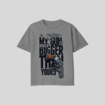 Grey My Gun Is Much Bigger Than Yours Unisex T-Shirt featuring a bold DTF graphic print on a premium cotton unisex tee.