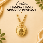 Gold-tone stainless steel Hamsa hand spinner pendant necklace with engraved hand symbol on a circular rotating centre