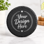 Custom round black slate coaster with “Your Design Here” engraving mockup, 4-inch personalized stone coaster for custom gifts and home décor.