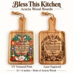 Acacia wood cutting board showing colourful UV textured print and laser engraved Bless This Kitchen designs